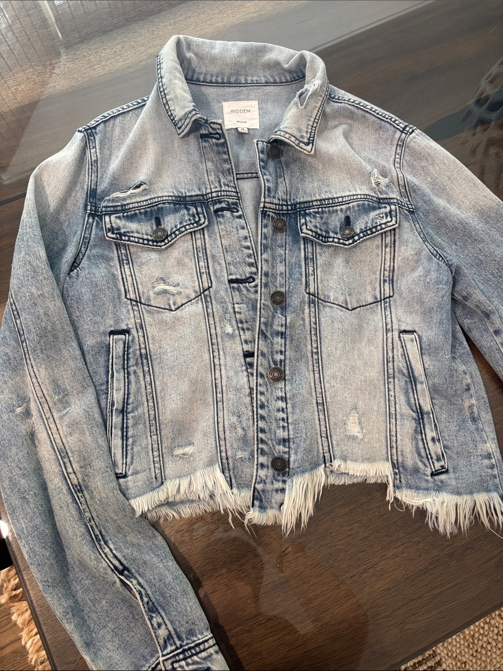 Distressed Light Blue Denim Jacket with Frayed Hem
